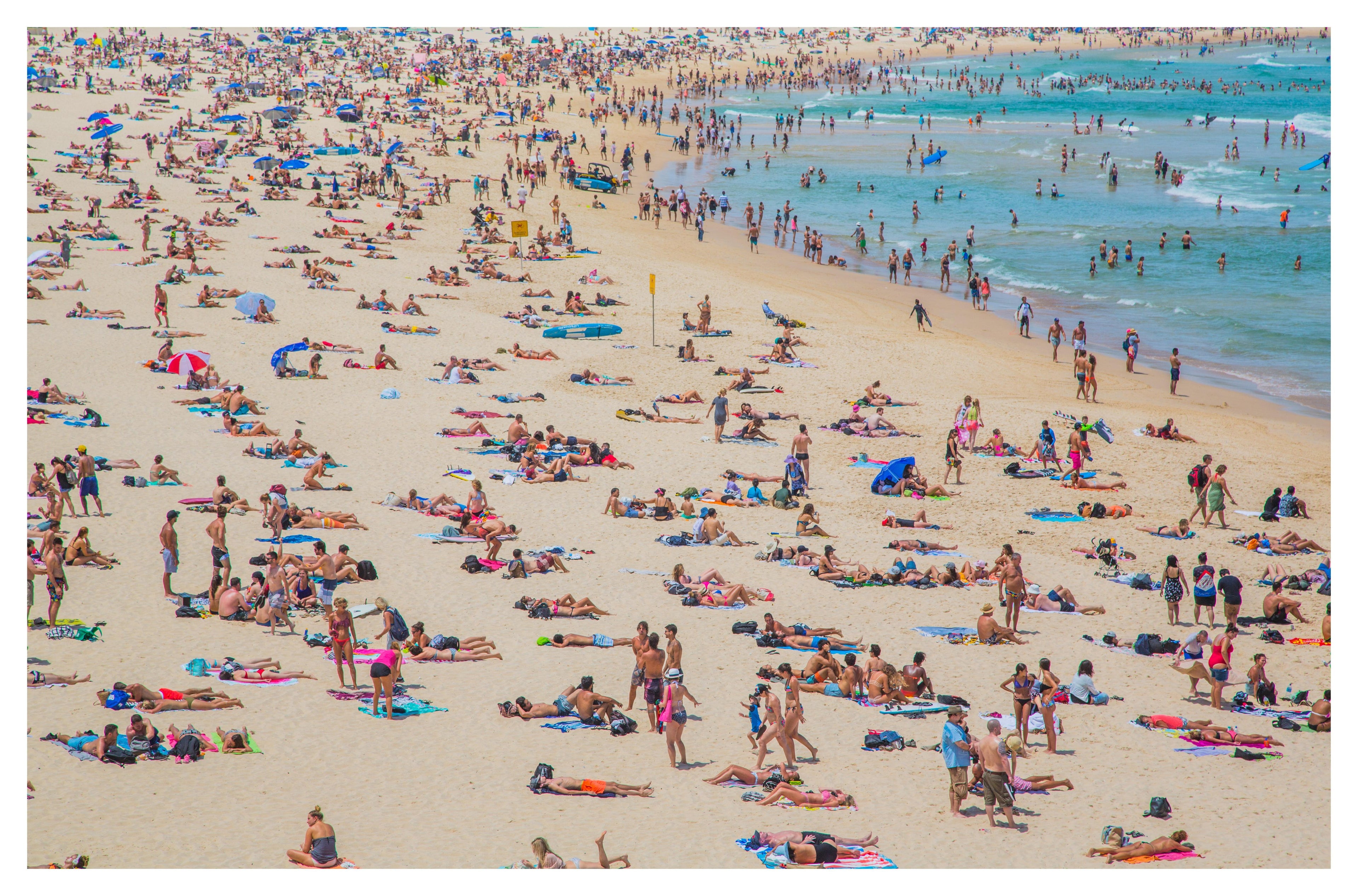 Ministry of the Sun — packed Bondi Icebergs beach from above